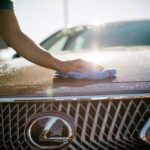 washing the hood of a Lexus car